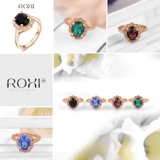 Aranyozott gyűrű, nagy alakú csiszolt bordó-lilás kővel, körülötte apró cirkóniummal