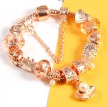 Rózsaarany színű karkötő - a tenger ihlette mintákkal - pezsgőszínű kristályos üveg és fém charm -  Pandora stílusú karkötő