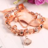 Rózsaarany színű karkötő - a tenger ihlette mintákkal - pezsgőszínű kristályos üveg és fém charm -  Pandora stílusú karkötő