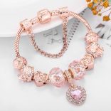 Rózsaarany színű csillogó rózsaszín kristályos üveg és fém szív mintás charm Pandora stílusú karkötő