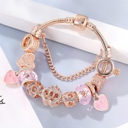   Rózsaarany színű csillogó rózsaszín kristályos üveg és fém koronás szív mintás charm Pandora stílusú karkötő