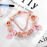 Rózsaarany színű csillogó rózsaszín kristályos üveg és fém koronás szív mintás charm Pandora stílusú karkötő