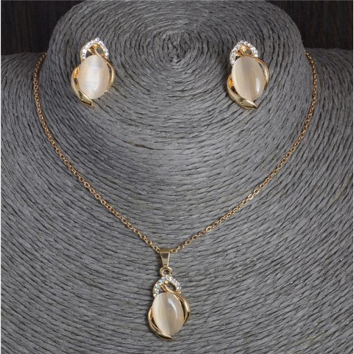 Absztrakt mintás nyaklánc és fülbevaló apró kristályokkal és holdkővel díszítve