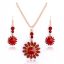 Aranyozott nyaklánc,fülbevalókkal bordó-piros kristályokkal