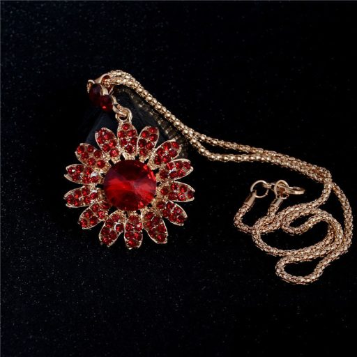 Aranyozott nyaklánc,fülbevalókkal bordó-piros kristályokkal