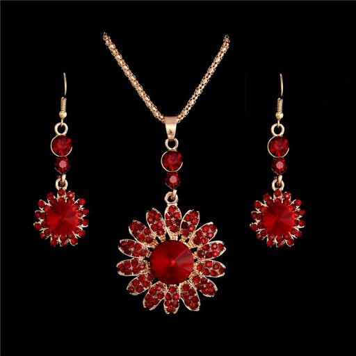 Aranyozott nyaklánc,fülbevalókkal bordó-piros kristályokkal
