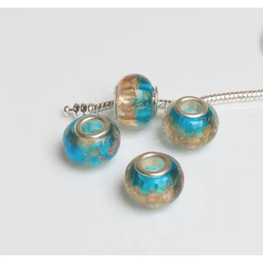 Kézzel készített lampwork üveg kék-pezsgő-arany charm